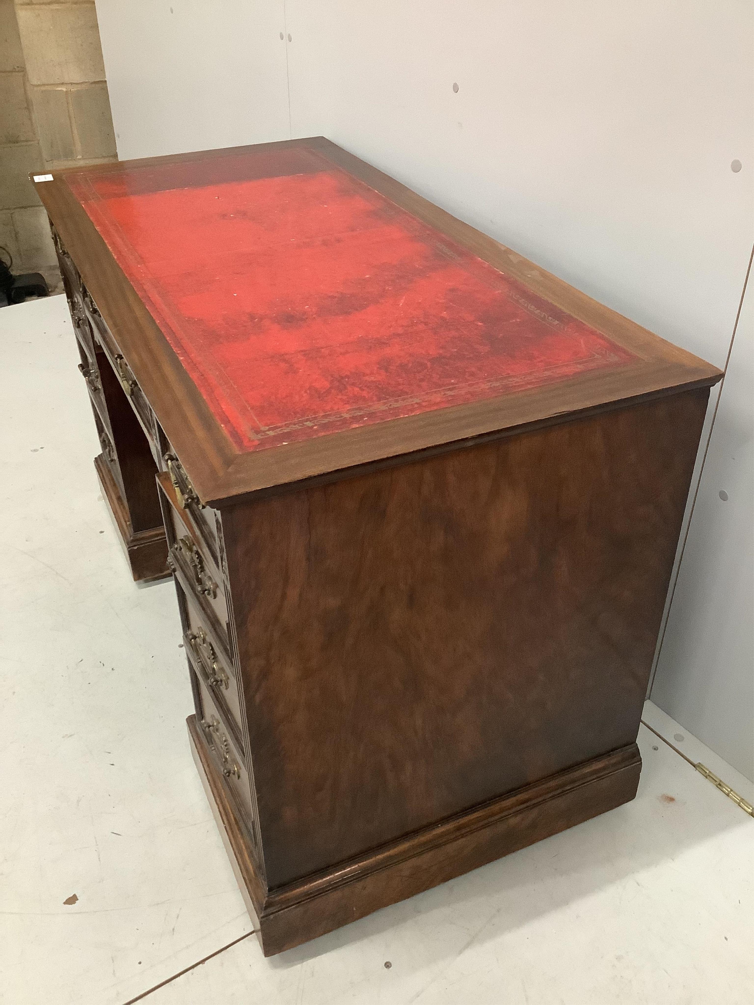 A late Victorian mahogany kneehole desk, width 120cm, depth 59cm, height 74cm. Condition - fair